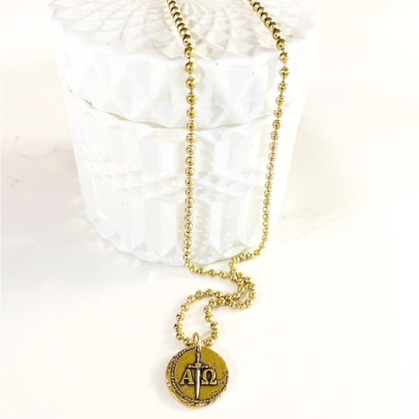 Gold Greek alpha omega symbol coin necklace on stainless gold ball chain