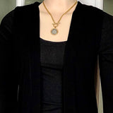 Bbeni lion coin in holder curb toggle chain necklace