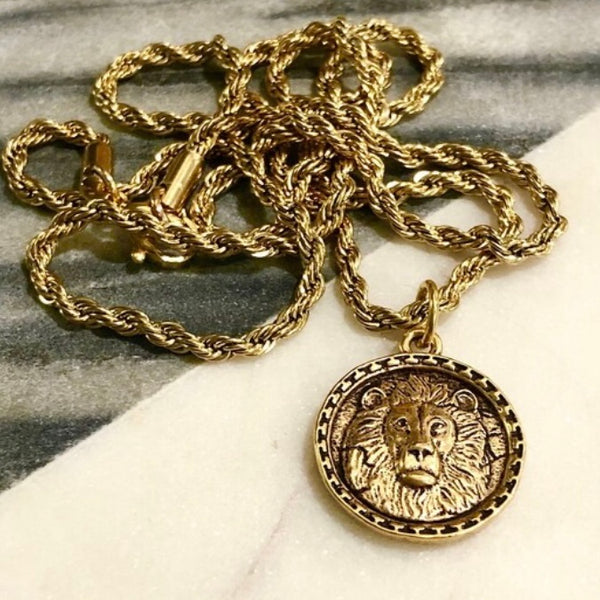 Gold or silver lion coin on rope chain
