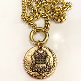 Gold coin necklace on heavy cable chain