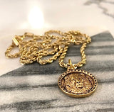 Gold or silver lion coin on rope chain